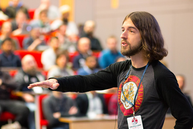 Ryan speaking to Drupal Camp London about prioritizing giving back in Drupal. - photo Paul Johnson