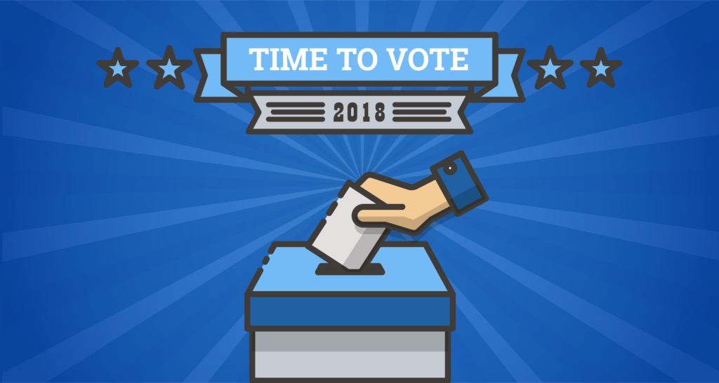 Hand placing a voting slip into a ballot box