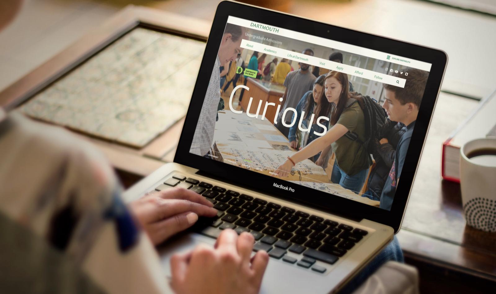 The Dartmouth homepage displayed on a laptop