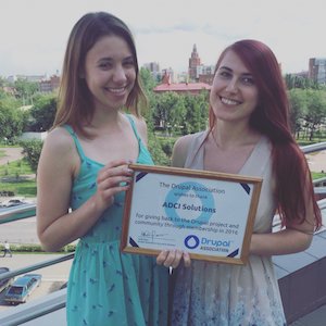 ADCI team holding their certificate of membership in 2016