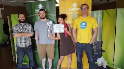Cheeky Monkey team holding their certificate of membership in 2016