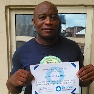 Chimezie Chuta holding their certificate of membership in 2016