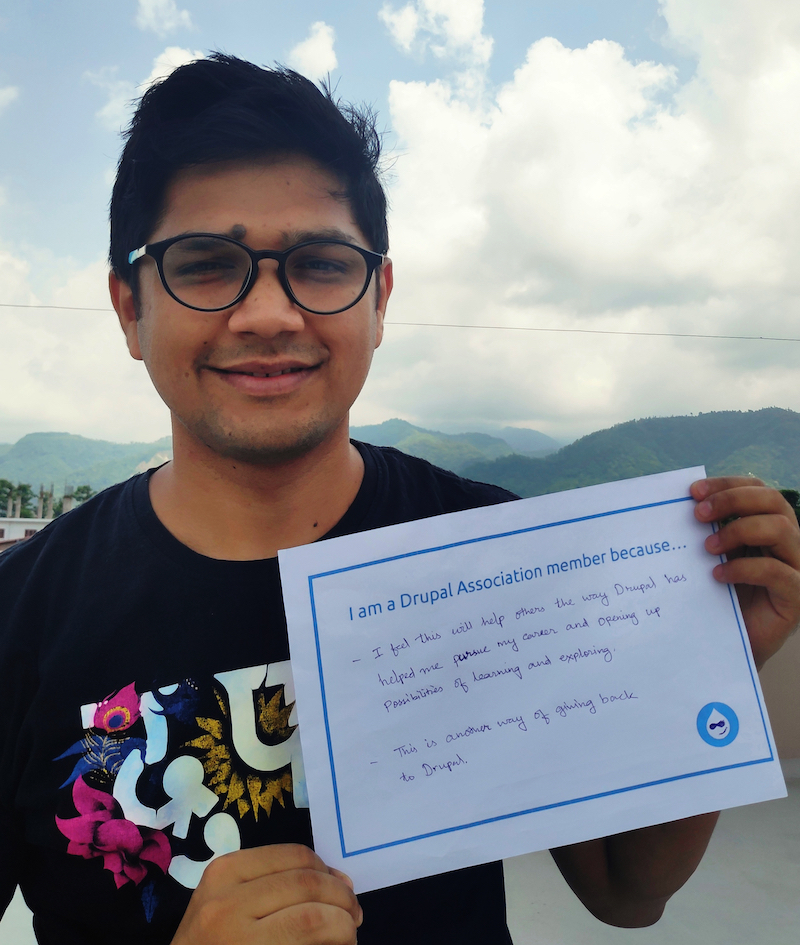 Jaideep's photo holding sign saying why they are a member