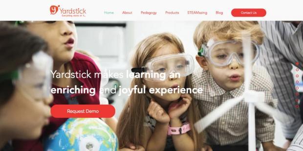 yardstick LMS homepage with an image of students looking at an experiement