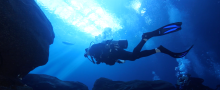 Diver in very blue water