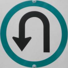 A U-Turn only sign.